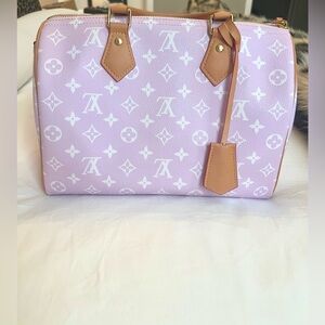 Pink and white monogram, faux leather
Top handle .